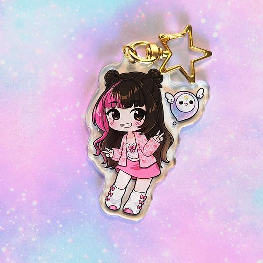 Keychain with a cartoon character on a pastel gradient background