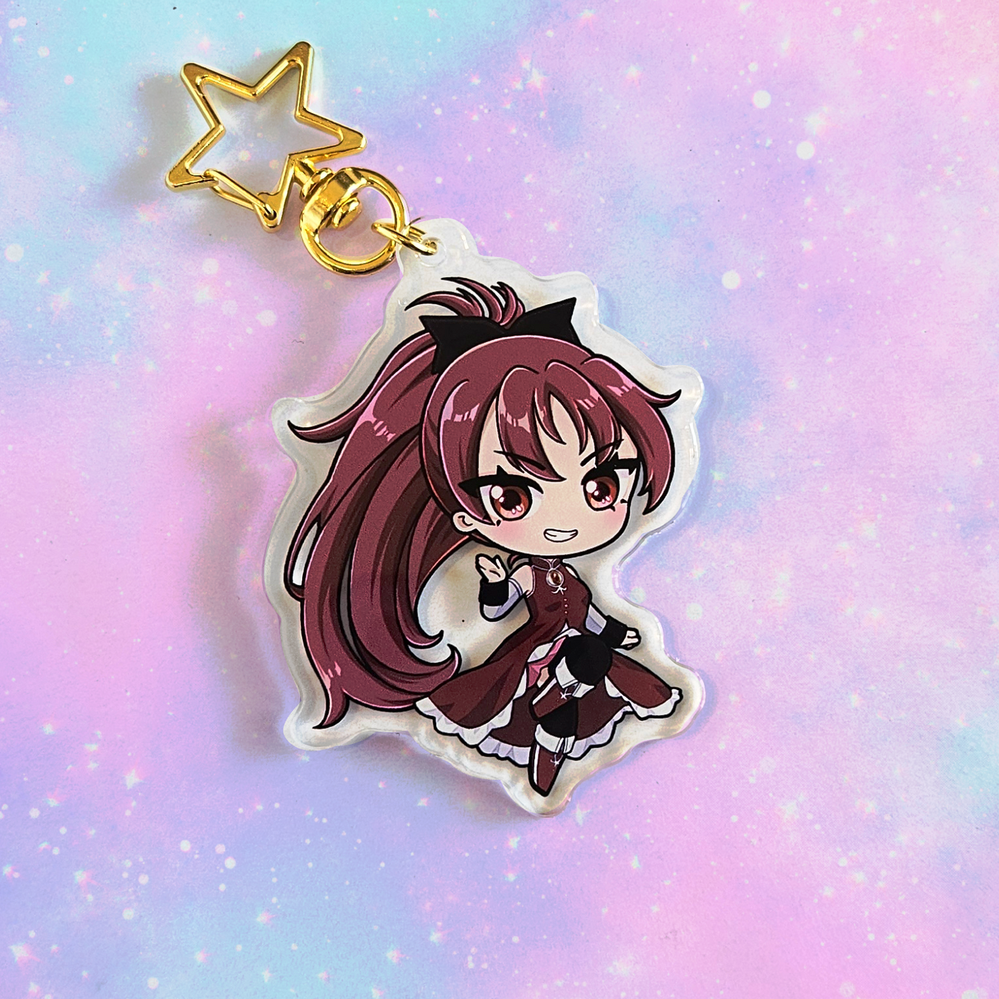 Anime character keychain with a gold star charm on a pastel gradient background