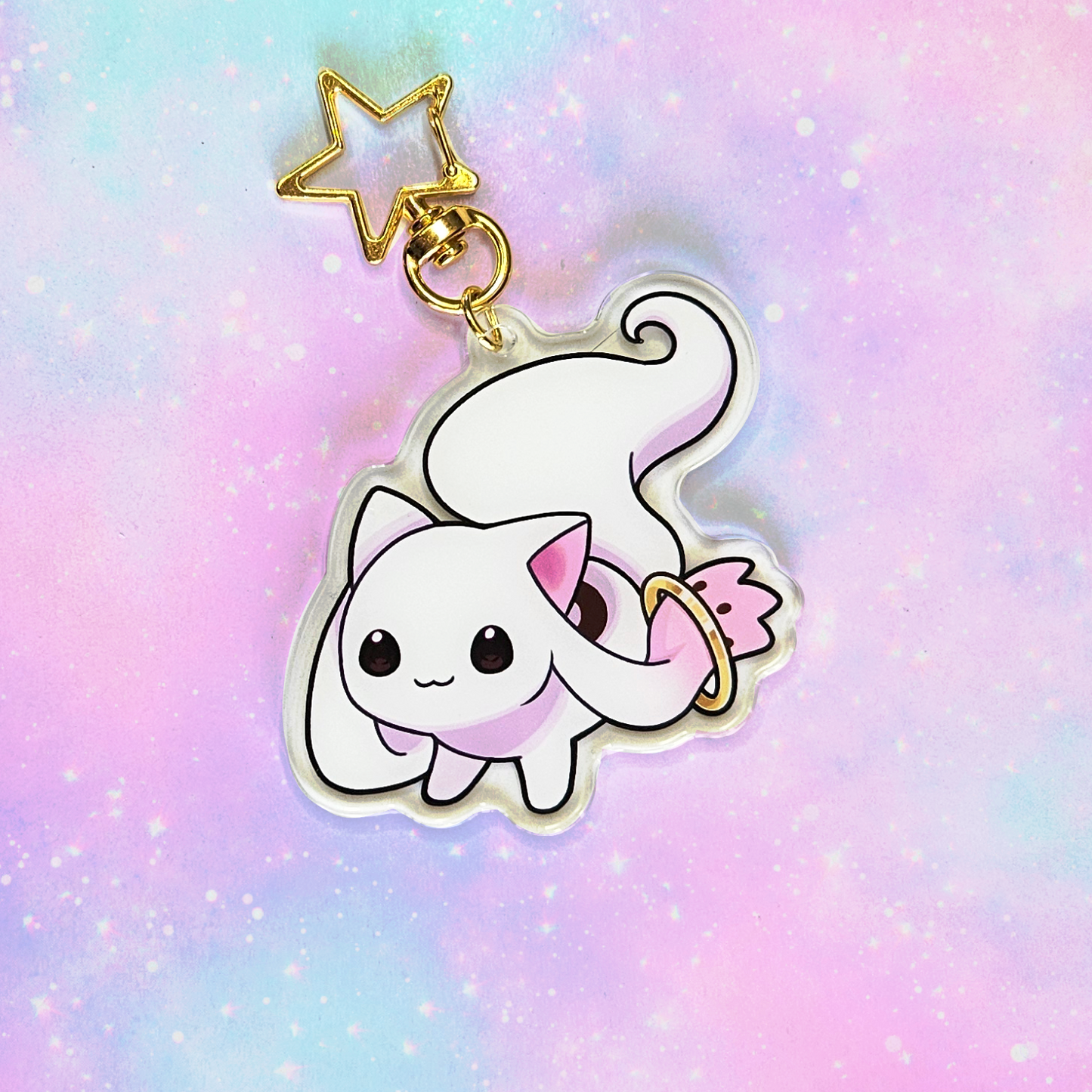 Kawaii cat charm with a star on a pastel gradient background