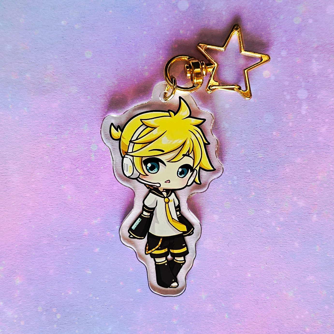 Anime character charm with a star on a gradient purple and blue background