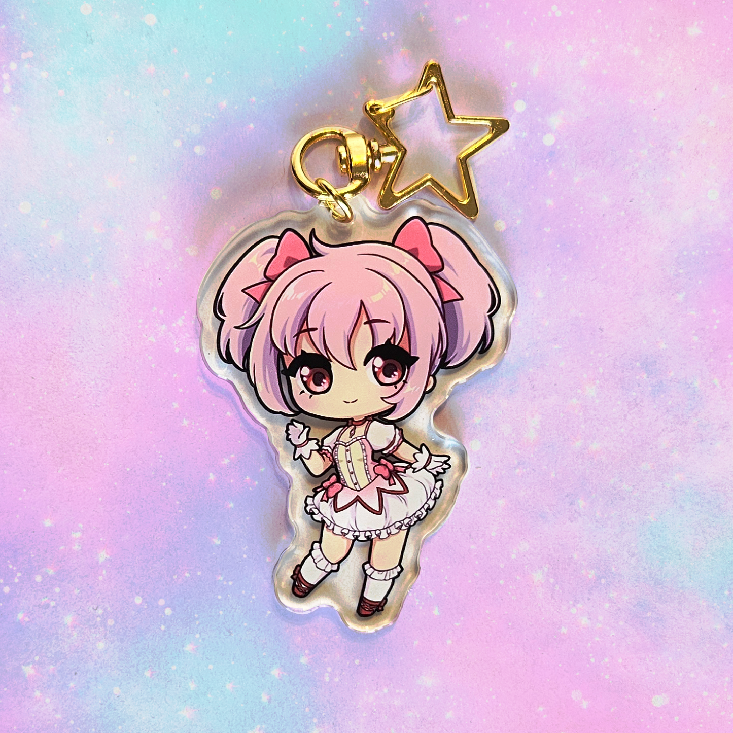Anime character keychain with pink hair on a pastel gradient background