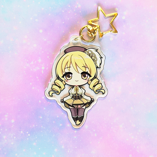 Anime character keychain with a star on a pastel gradient background
