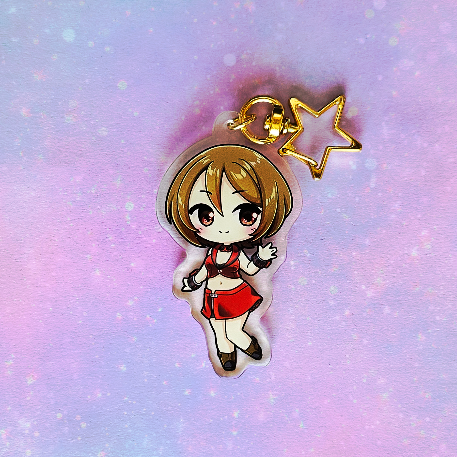Anime character charm with a star on a pastel gradient background