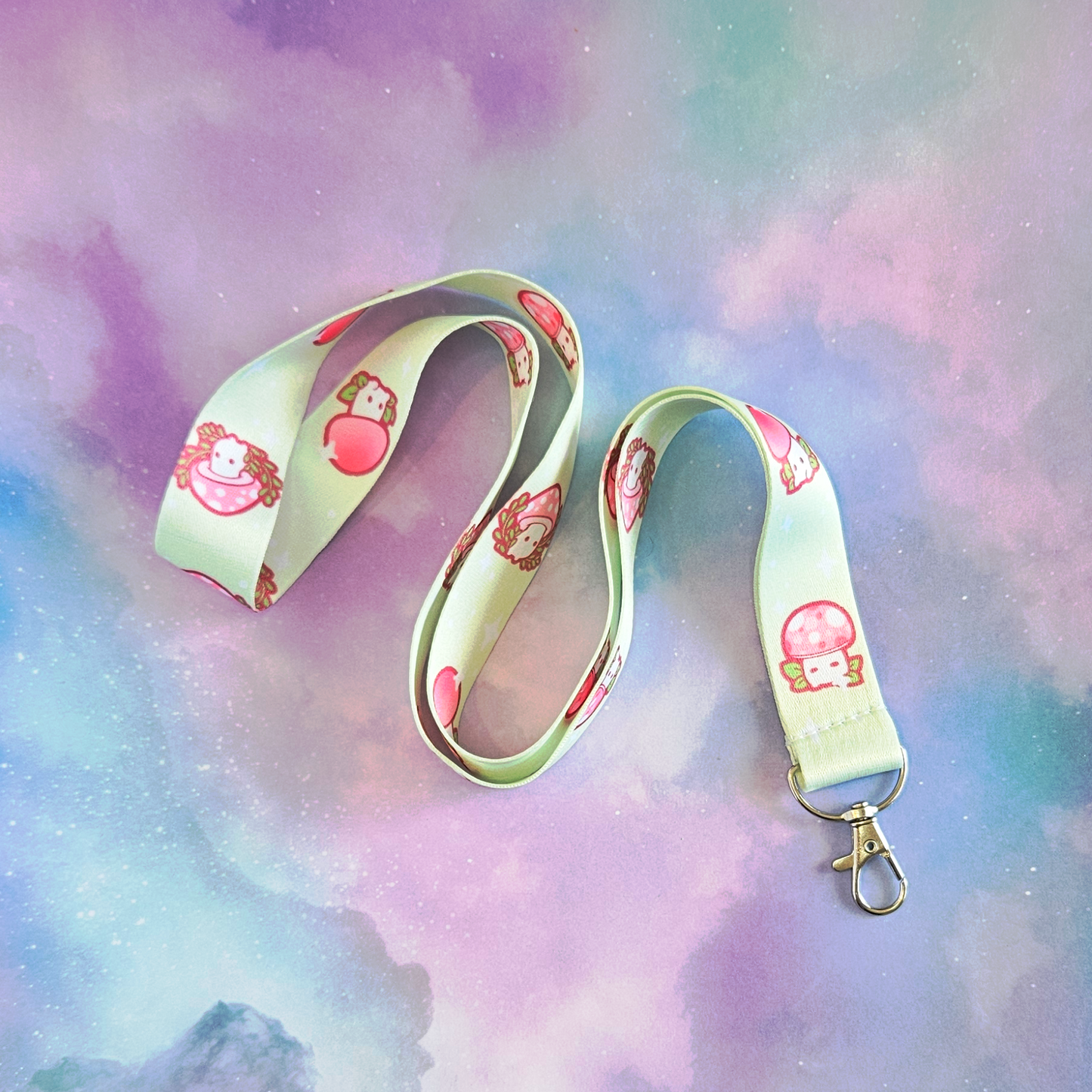 Lanyard with cartoon character design on a pastel cloud background