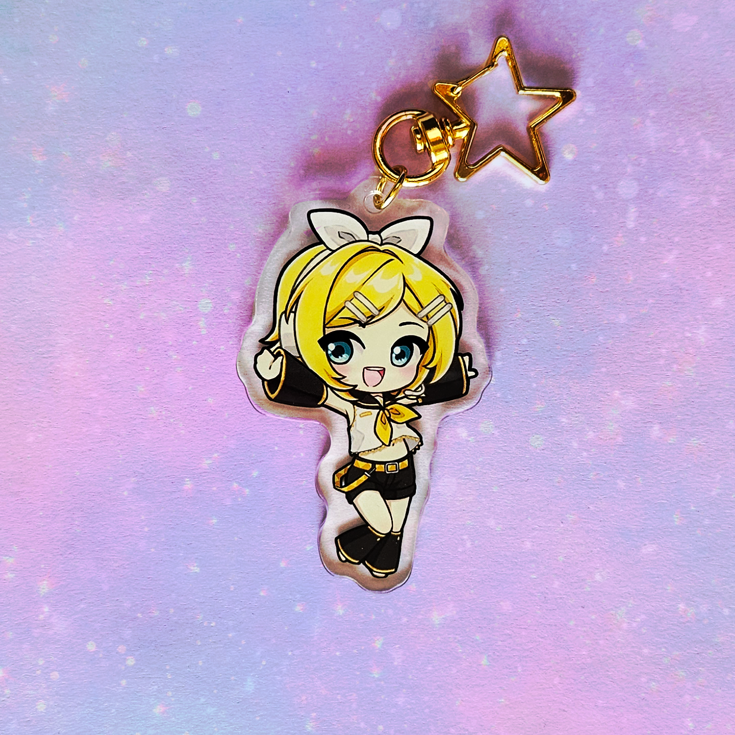 Anime character charm with a star on a pastel gradient background