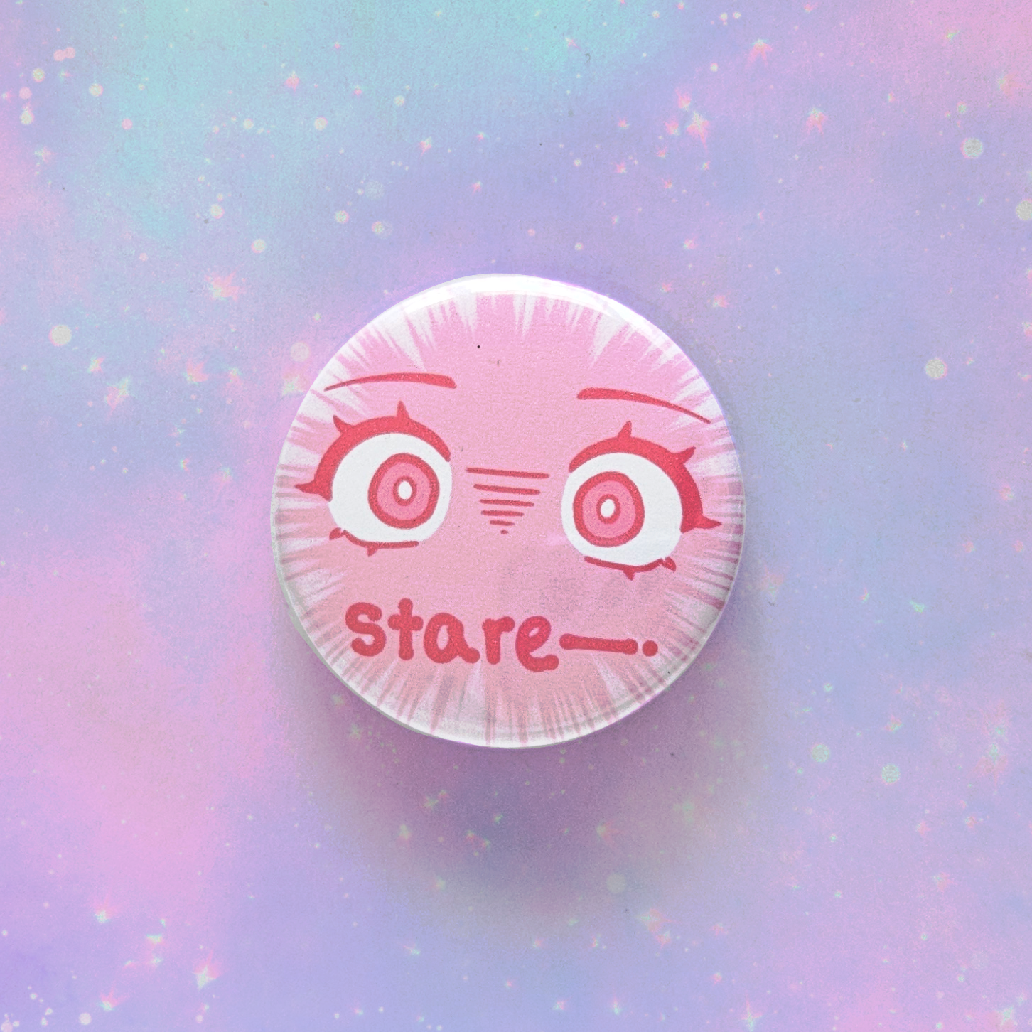 Circular object with cartoon face and 'stare' text on a pastel gradient background